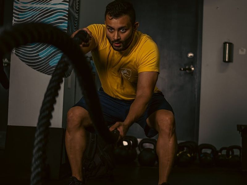 Man in a calm, focused state before a workout session.